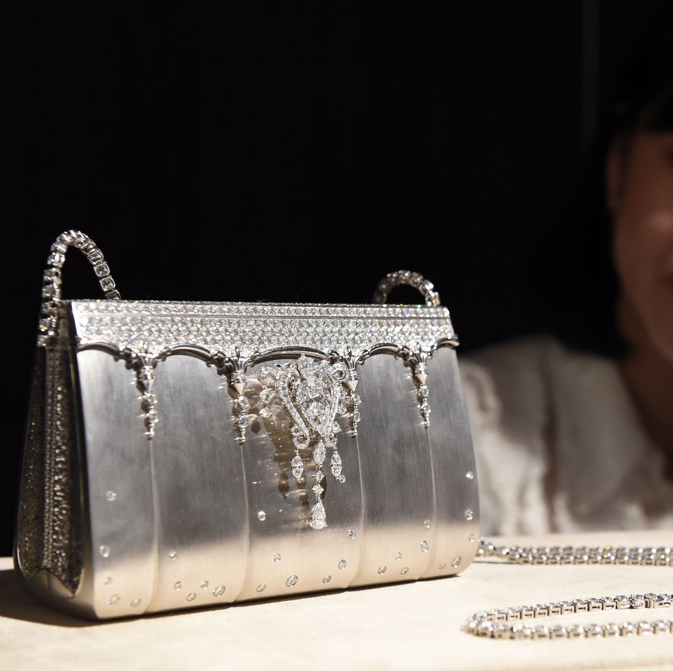 a ginza tanaka employee shows off 200 million yen 1,626,016 usd diamond bijou bag made of 208ct, 2182 diamonds and platinum during a platinum exhibition press preview in tokyo on june 18, 2015 japans jewelry company, ginza tanaka will hold the exhibition, the story of platinum together with platinum guild international from june 19 to july 31 afp photo  toshifumi kitamura photo credit should read toshifumi kitamuraafp via getty images