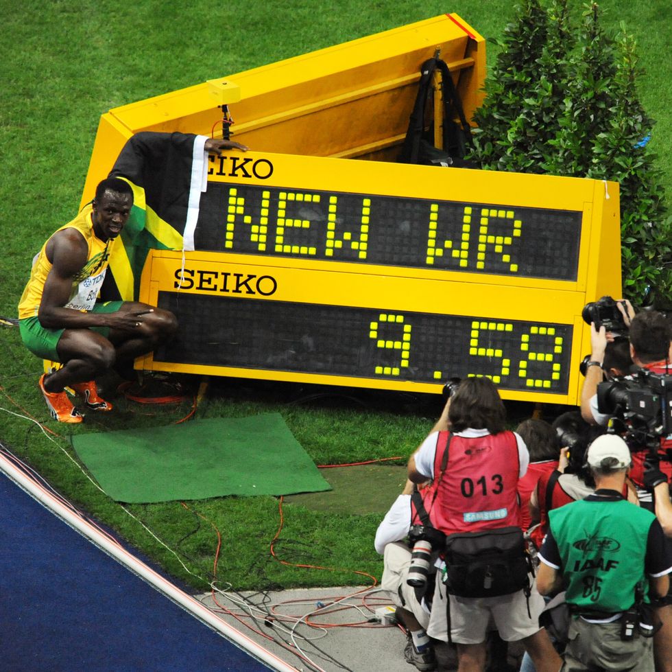 Jamaica's Usain Bolt (L) celebrates winn