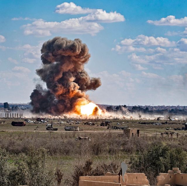 topshot   smoke and fire billow after shelling on the islamic state group's last holdout of baghouz, in the eastern syrian deir ezzor province on march 3, 2019   kurdish led forces backed by us warplanes rained artillery fire and air strikes on besieged and outgunned jihadists making a desperate last stand in a syrian village photo by delil souleiman  afp        photo credit should read delil souleimanafp via getty images