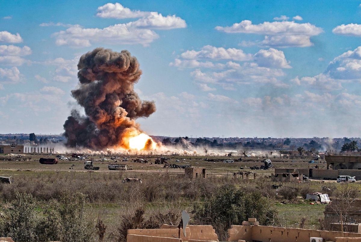 topshot   smoke and fire billow after shelling on the islamic state group's last holdout of baghouz, in the eastern syrian deir ezzor province on march 3, 2019   kurdish led forces backed by us warplanes rained artillery fire and air strikes on besieged and outgunned jihadists making a desperate last stand in a syrian village photo by delil souleiman  afp        photo credit should read delil souleimanafp via getty images