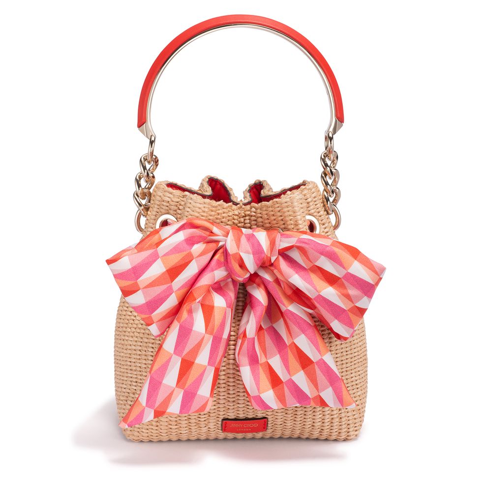 a purse with a pink and white bow