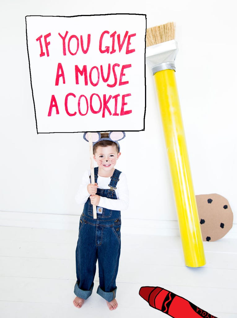 little boy dressed as the mouse from the book if you give a mouse a cookie