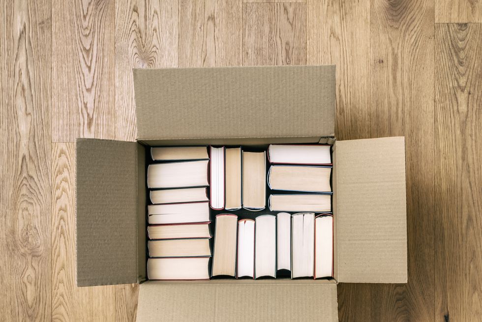 books in cardboard box top view