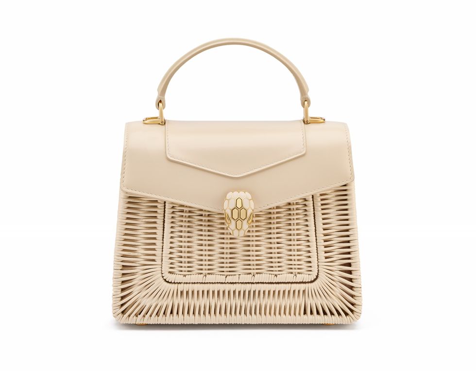 a brown handbag with a white background