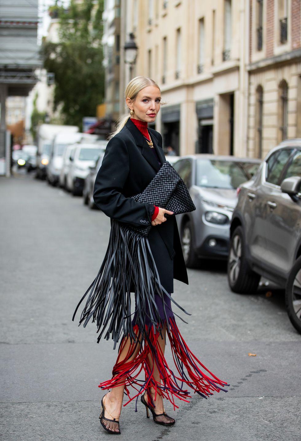 paris, france   october 08 leonie hanne is seen wearing black maison margiela blazer, purple red dress with fringes bottega veneta and bag with fringes, heels during a street style fashion photo session on october 08, 2020 in paris, france photo by christian vieriggetty images