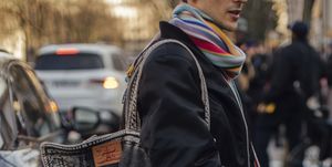 a person carrying a large black purse