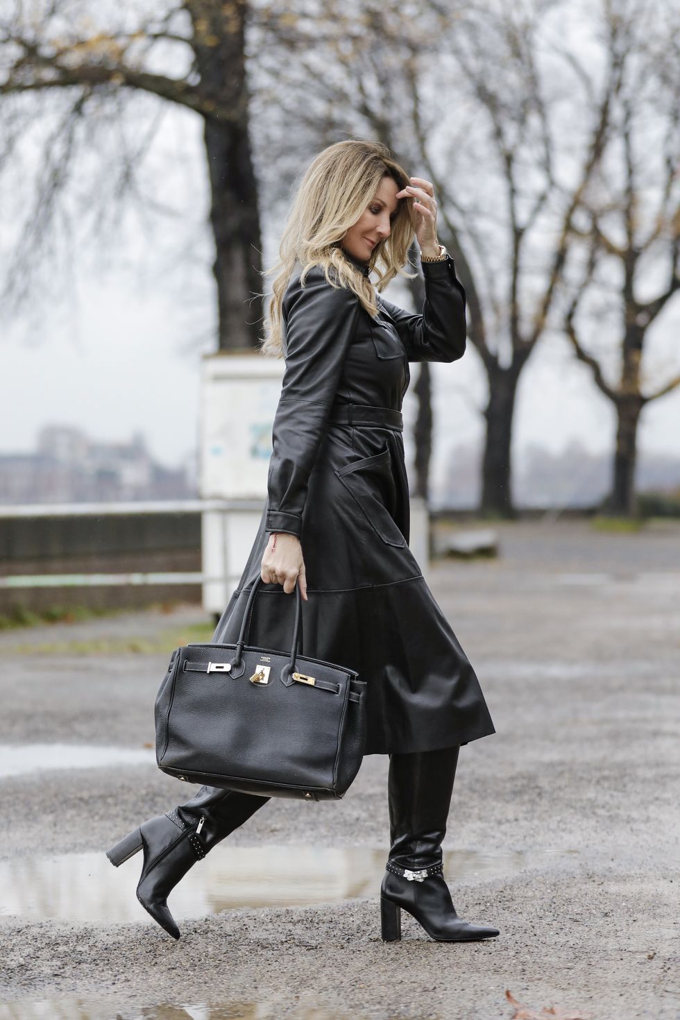 cologne, germany   december 09 german tv host frauke ludowig wearing black knee high boots by steffen schraut, a black midi length leather dress by riani and a black bag by hermes during a street style shooting on december 9, 2020 in berlin, germany photo by streetstyleshootersgetty images