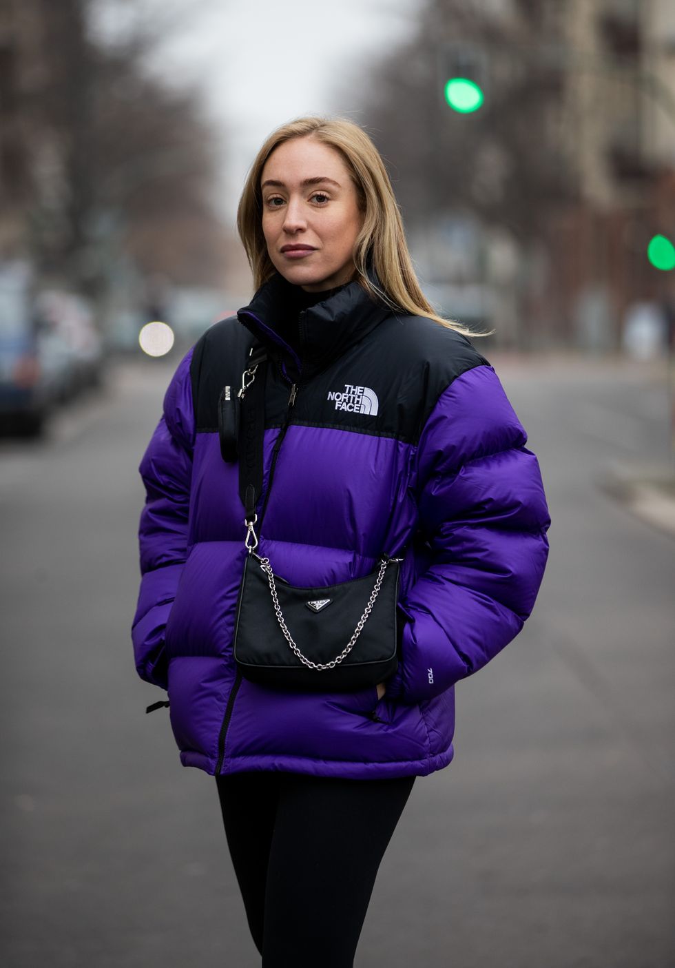 berlin, germany   december 10 sonia lyson is seen wearing prada bag, two tone puffer down feather jacket the north face in purple and black, lululemon leggins on december 10, 2020 in berlin, germany photo by christian vieriggetty images