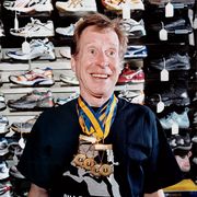 Brian Finke displays his Boston Marathon medals