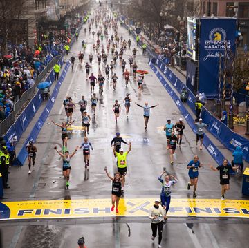 runners crossing the finish line at the boston marathon