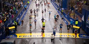 runners crossing the finish line at the boston marathon