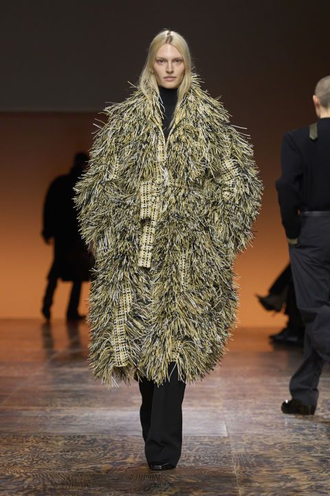 a person wearing a fur coat