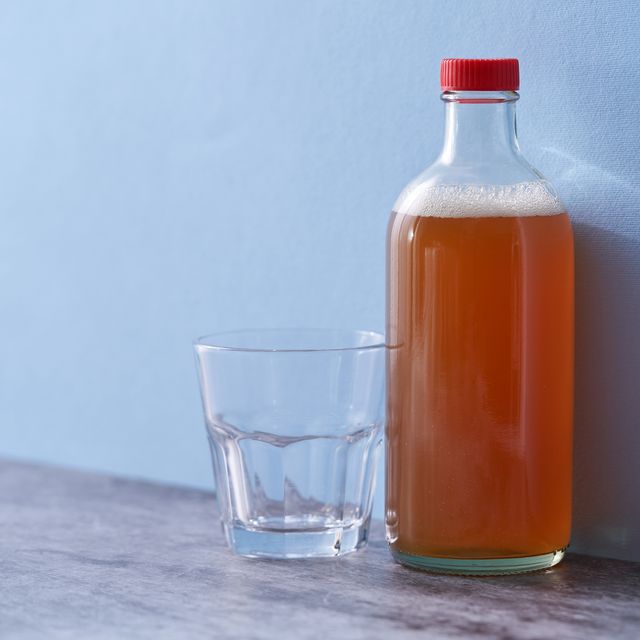 bottle of apple cider vinegar and empty drinking glass,malaysia