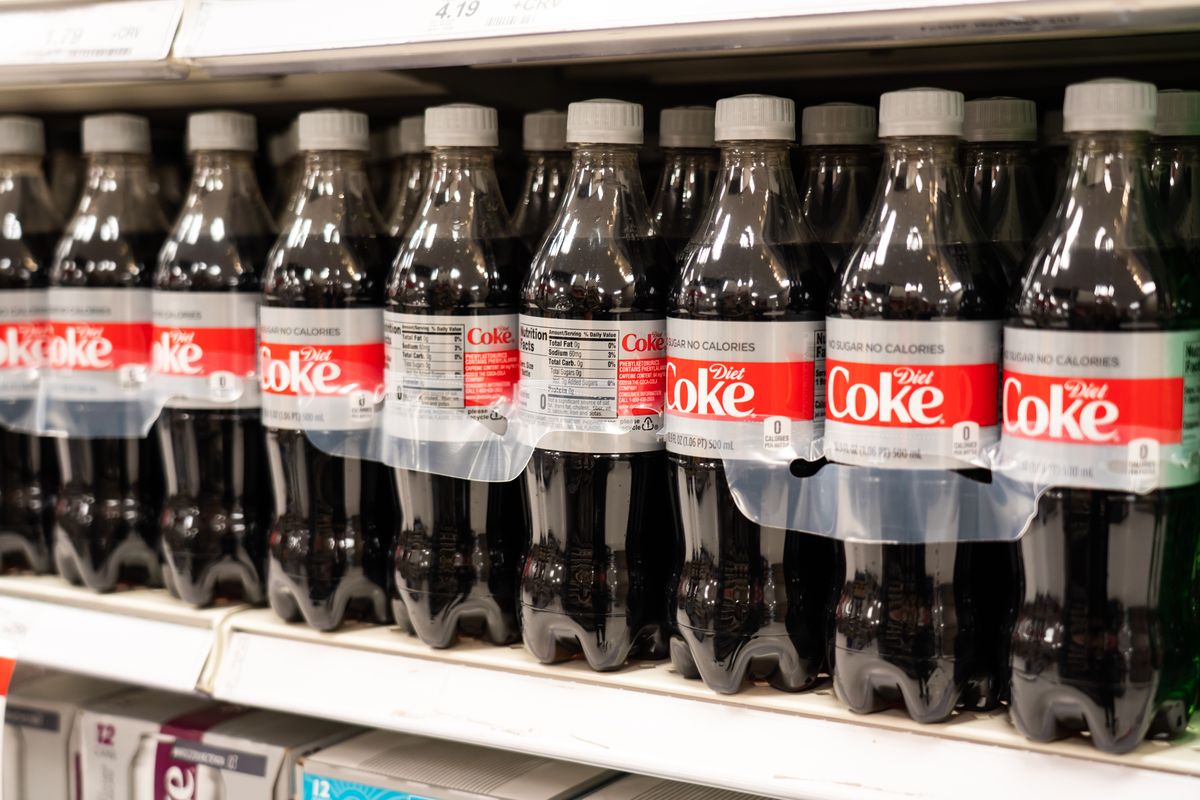 bottles of diet coke, a lemon lime beverage produced by the