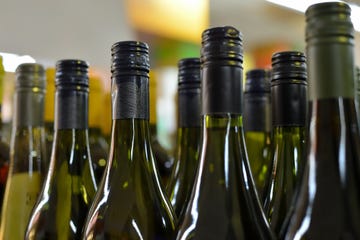 bottles of wine in rows in liquor store