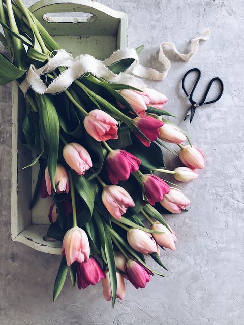 bouquet of tulips on a wooden tray