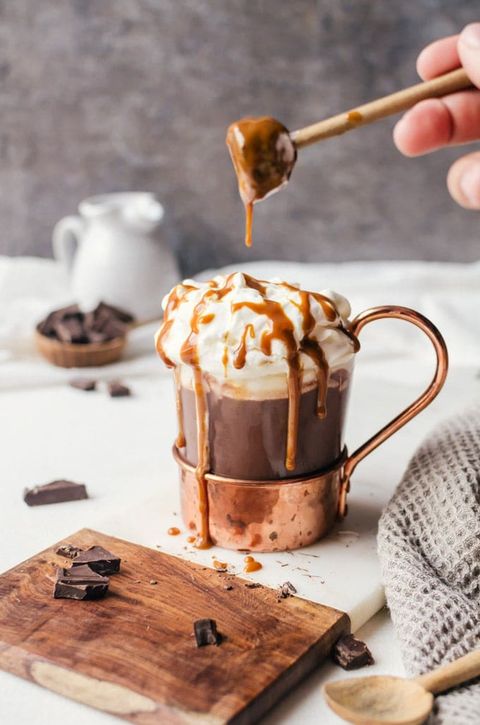 bourbon spiked hot chocolate in glass and copper mug
