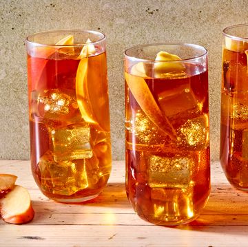 peach iced tea in a glass with bourbon