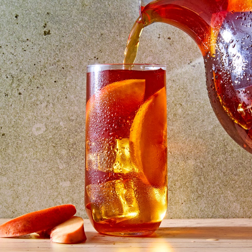 peach iced tea in a glass with bourbon