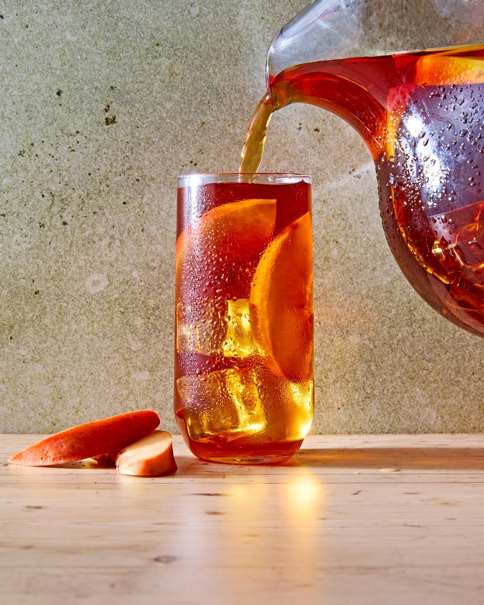 peach iced tea in a glass with bourbon