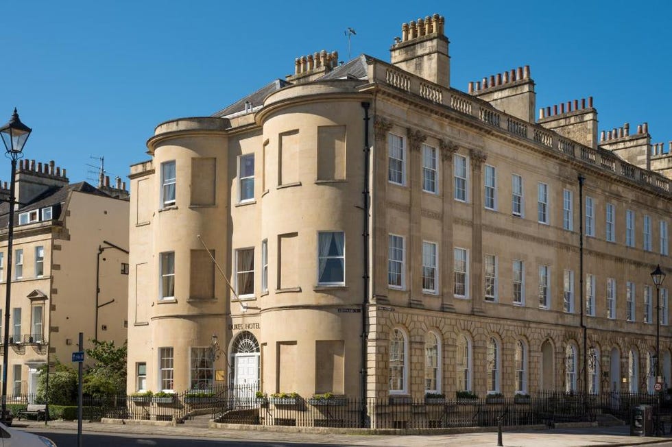 a large building with a fence in front of it