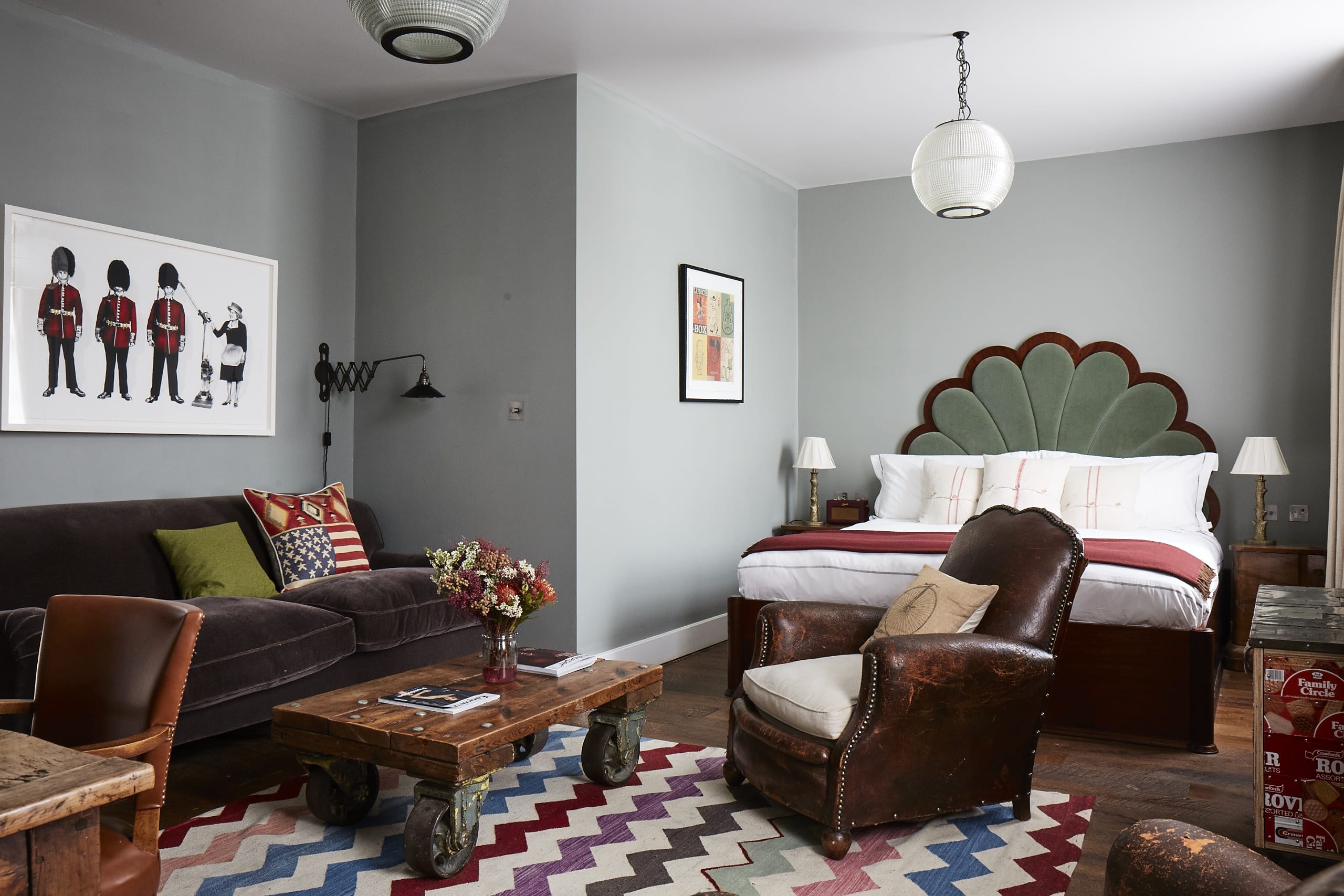 double bed and seating area in a grey bedroom