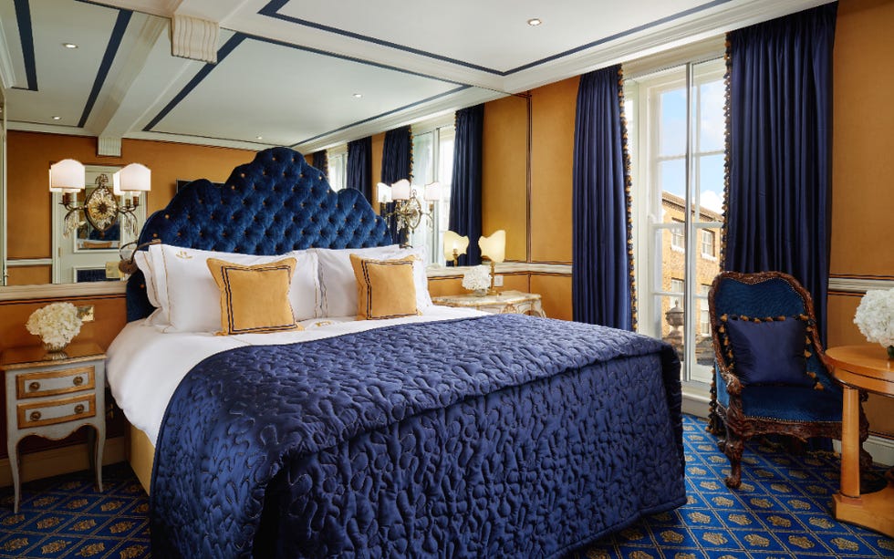 big blue double bed with blue and yellow decor