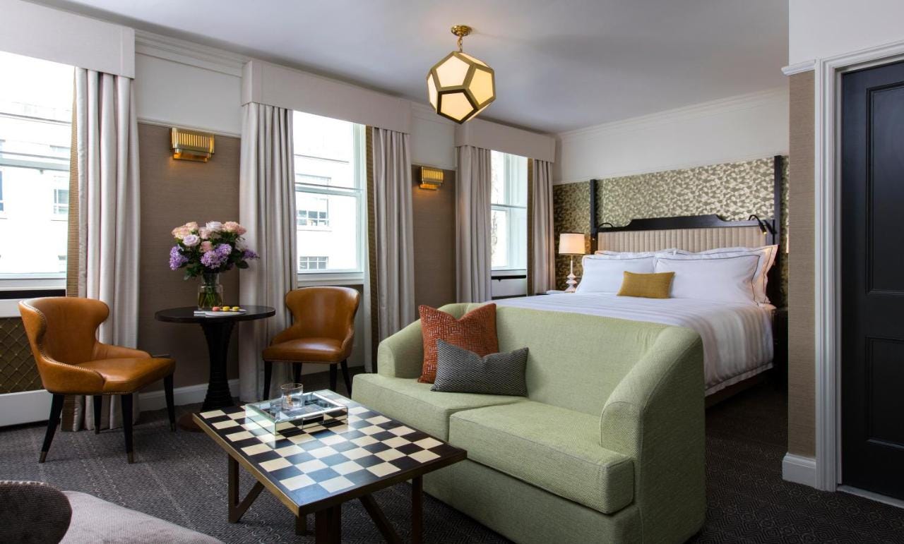 double bed and sofa in a guestroom