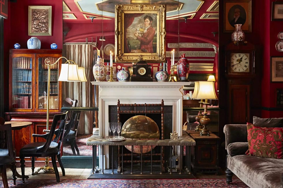lounge fireplace in a red room zetter marylebone