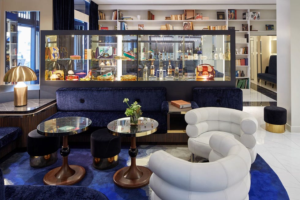 a lounge with chairs and tables at hotel bel ami