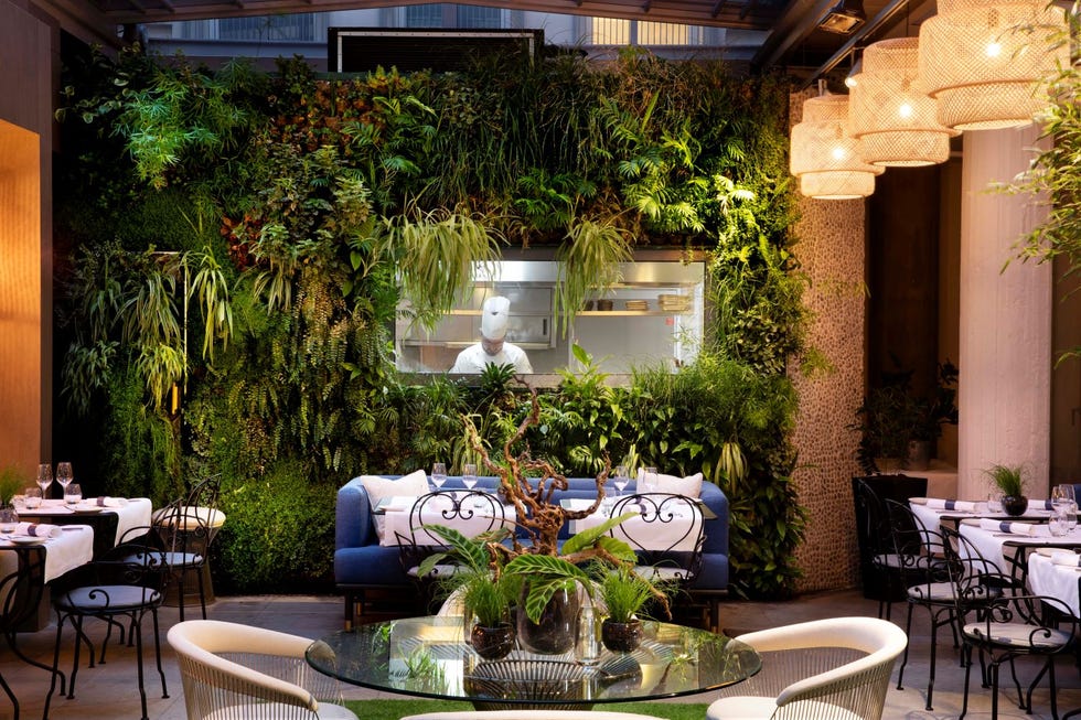 seating and living wall in restaurant at hotel de sers