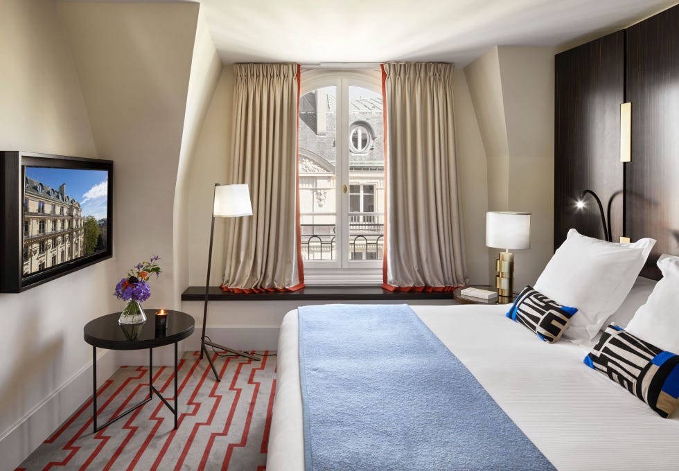 a bedroom with a large bed and window at hotel montalembert