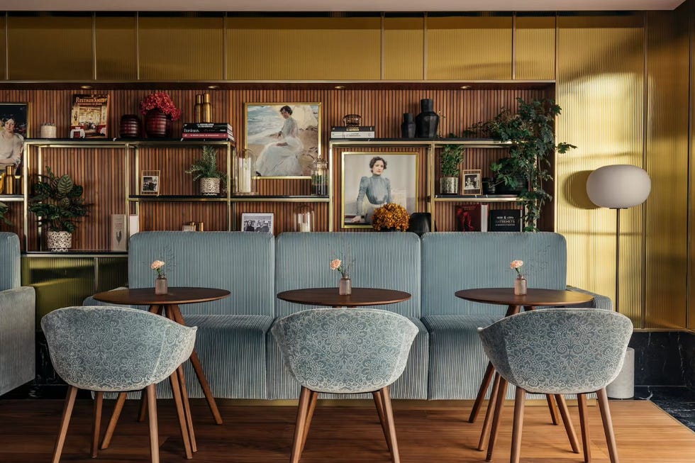 a room with tables and chairs at maison colbert