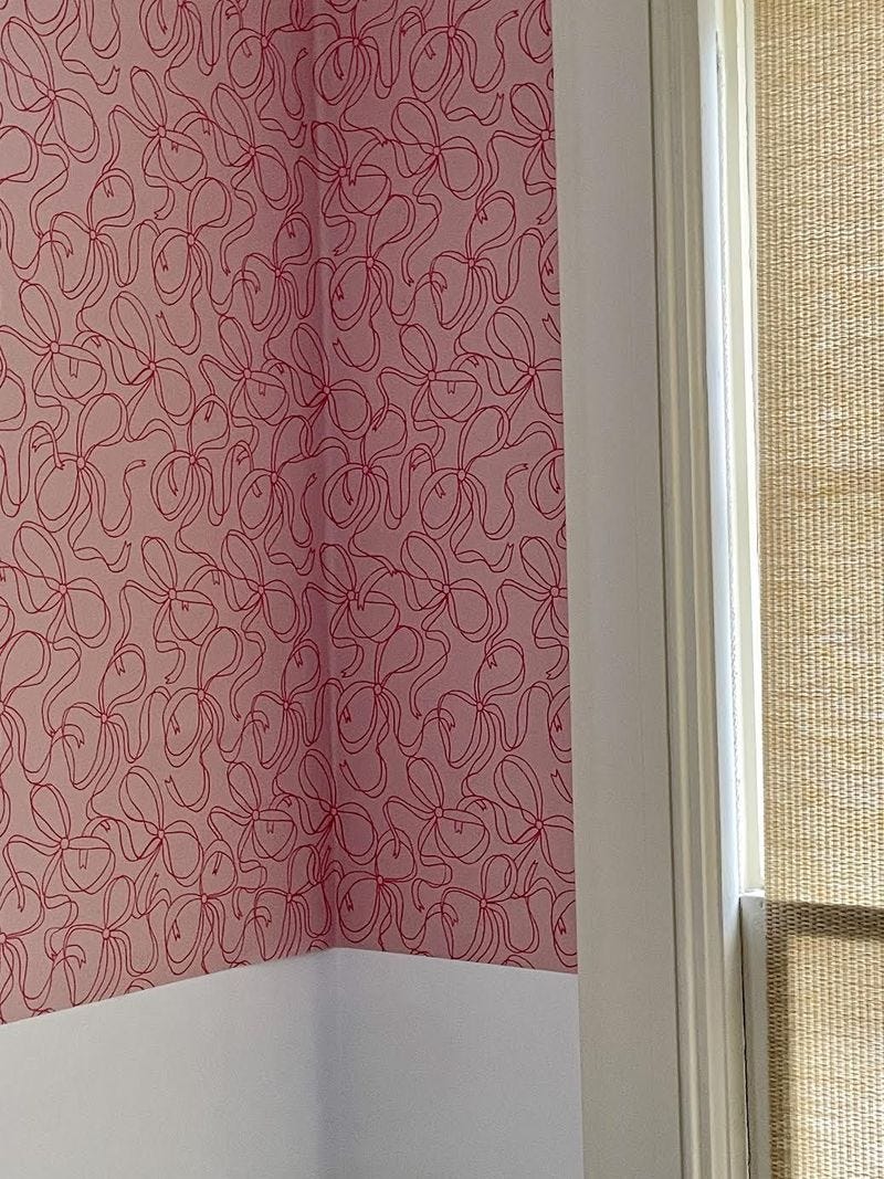 pink bow wallpaper in a room