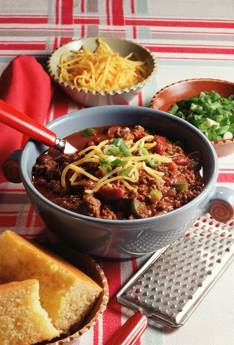 bowl of chili with condiments