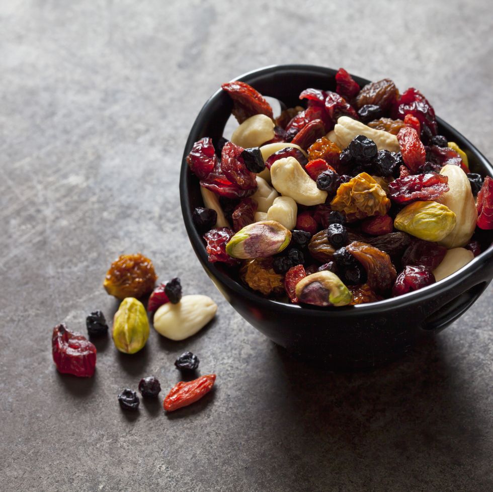 Bowl of dried fruits, pistachios, cashew nuts and almonds