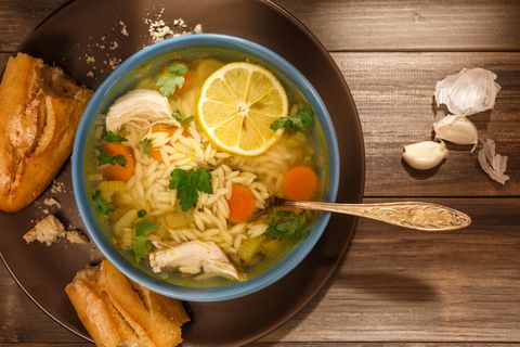 Bowl of Lemon Chicken Orzo Soup Rustic Style