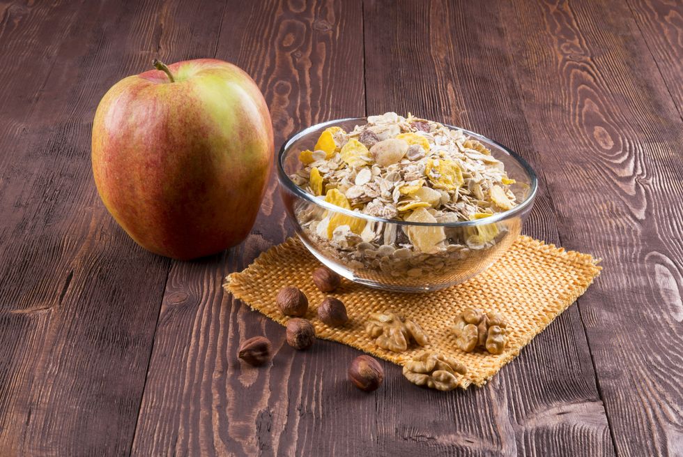 bowl of muesli, apple, nuts, flakes, candied  for a nutritious breakfast with a low glycemic index ensuring plenty of energy for the day.
