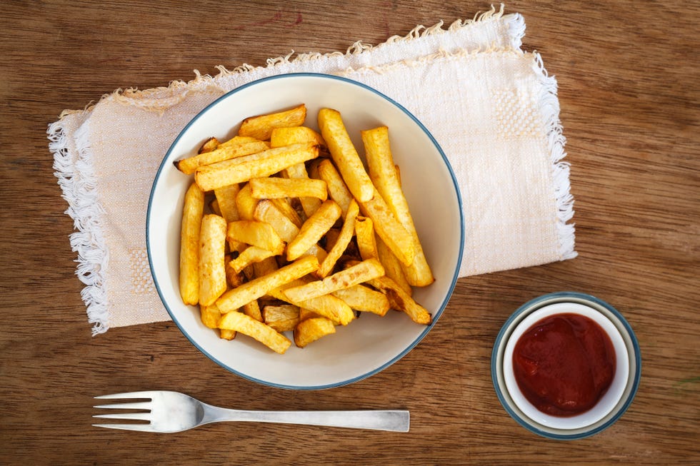 Bowl of swede fries and bowl of ketchup