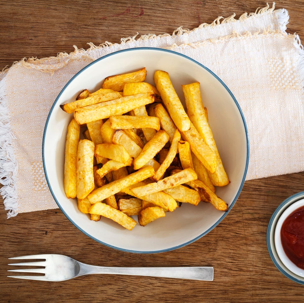 Bowl of swede fries and bowl of ketchup Bowl of swede fries and bowl of ketchup