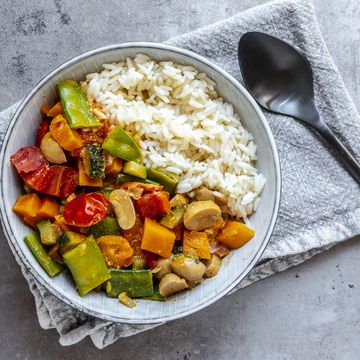 bowl of vegan sweet potatoe curry with rice, best types of carbs