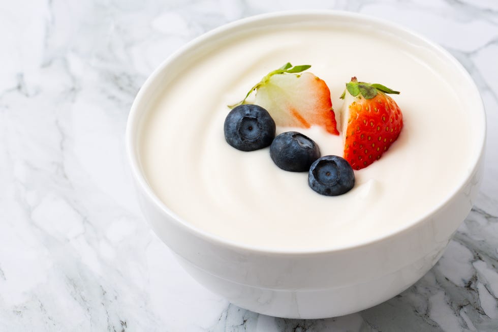 https://hips.hearstapps.com/hmg-prod/images/bowl-of-yogurt-and-fresh-berries-on-white-fresh-royalty-free-image-1619029492.?resize=980:*