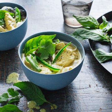 Bowls of chicken laksa and herbs bowls of chicken laksa and herbs