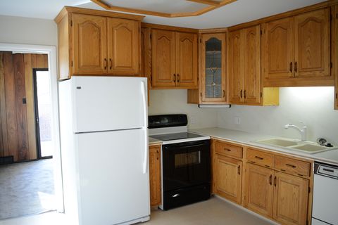 Cabinetry, Countertop, Room, Kitchen, Furniture, Property, Major appliance, Floor, House, Cupboard, 