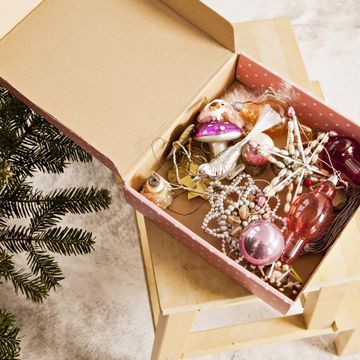 box with chistmas ornaments next to christmas tree, munich, bavaria, germany