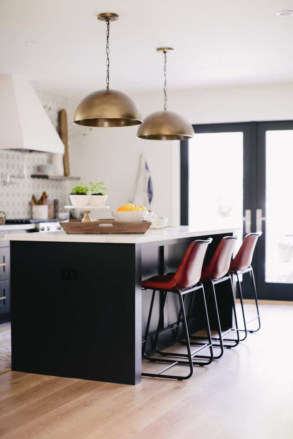 small kitchen island with red chairs