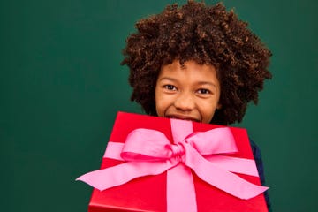 boy holding wrapped red present