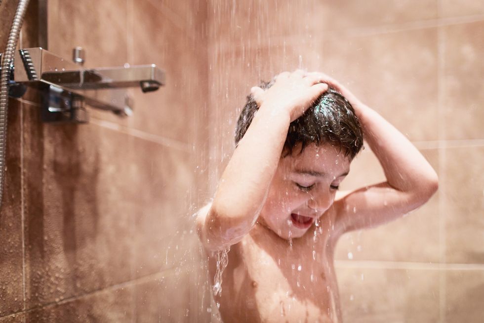 boy taking a shower