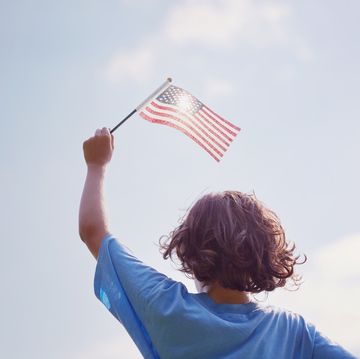 boy waving american flag