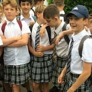 Boys protest against uniform ban and wear skirts to school